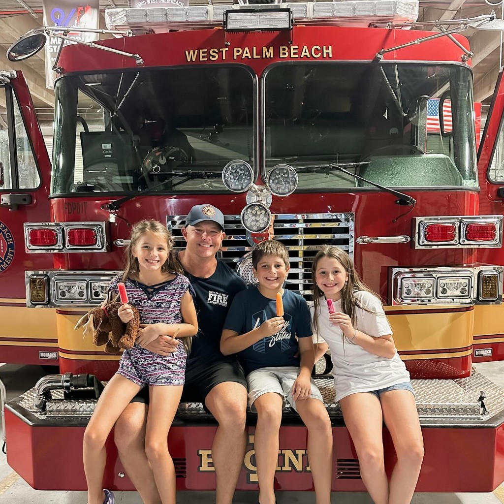 Ryan and his kids on a West Palm Beach fire truck